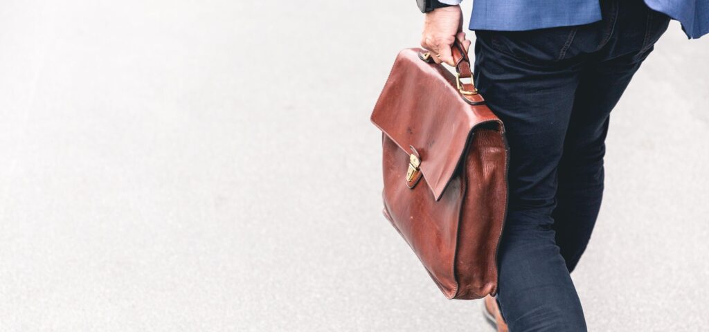 Consultant walking with briefcase