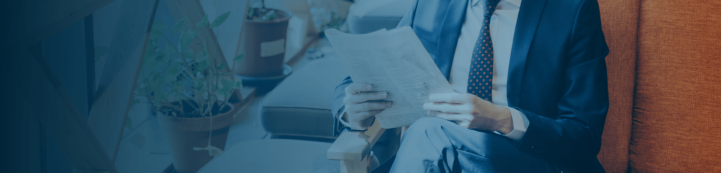 Professional reading business article – hero image for insights and updates