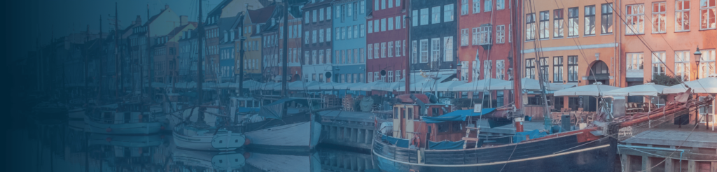 Nyhavn harbour in Copenhagen with colourful buildings and boats – Umbrella Company Denmark