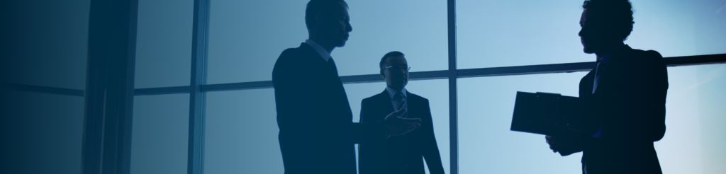 Business professionals in discussion – compliance and workforce solutions in the Nordics