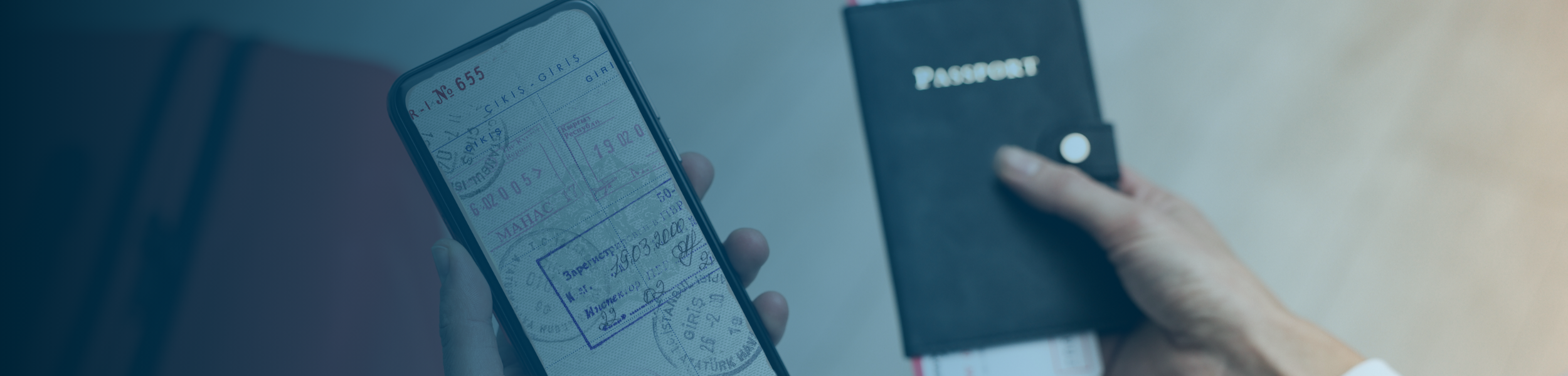 Person holding a smartphone with digital passport stamps next to a physical passport.