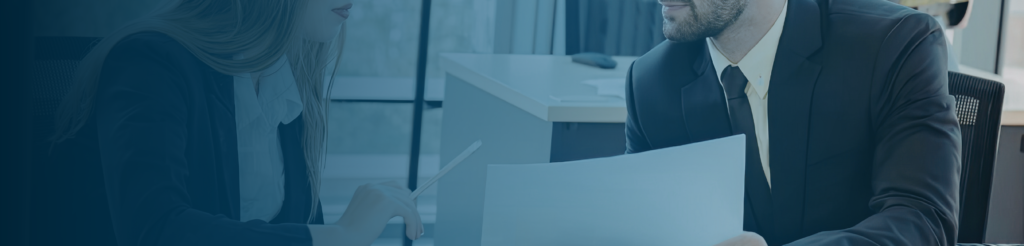 Two professionals reviewing documents together to align expectations before onboarding