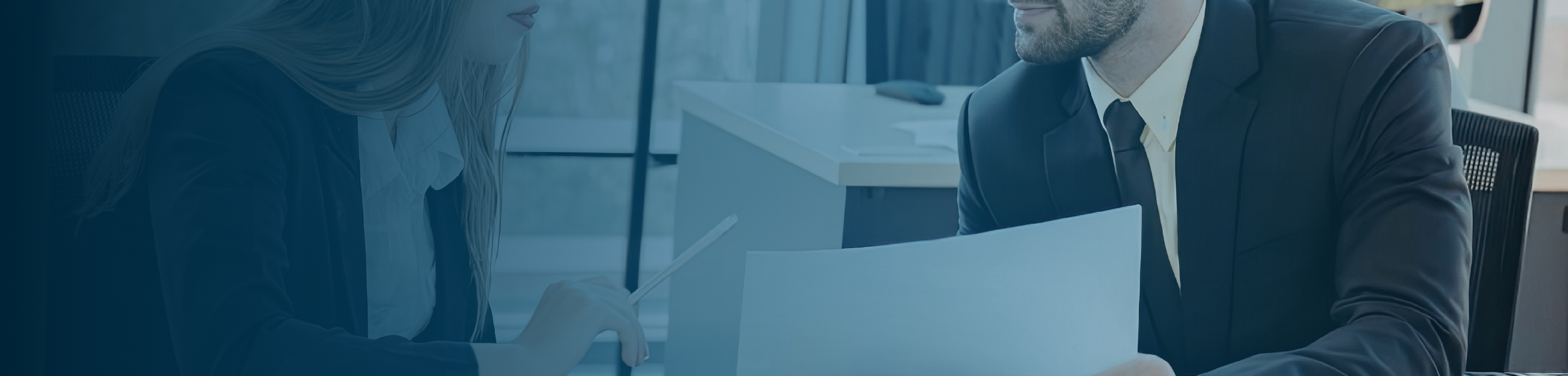 Two professionals reviewing documents together to align expectations before onboarding